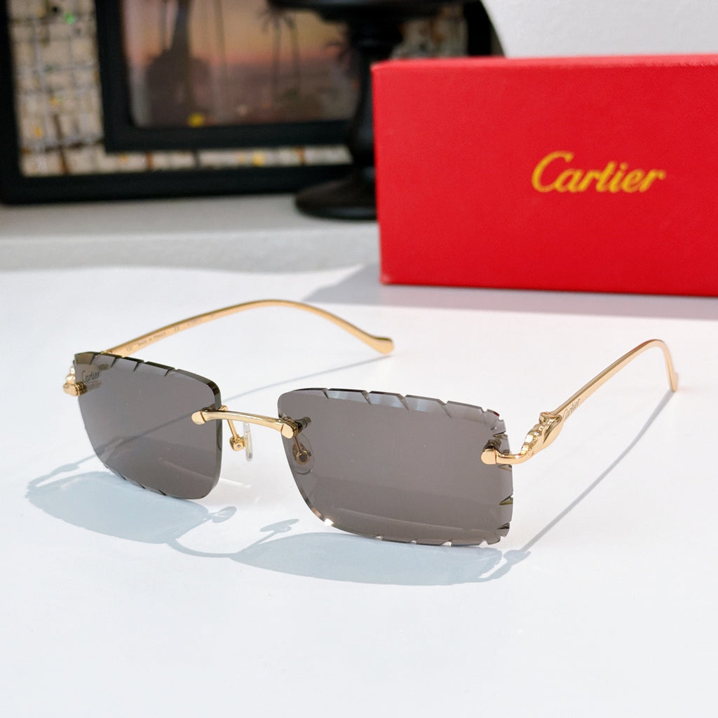 Gold-rimmed cat-eye sunglasses with dark gray gradient lenses