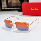 Gold-rimmed cat-eye sunglasses with orange gradient lenses