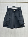 Navy cargo shorts with elastic waistband, drawstring, side and flap pockets