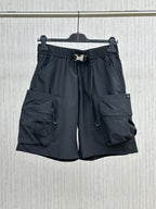 Navy cargo shorts with elastic waistband, drawstring, side and flap pockets