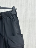 Navy cargo shorts with front button and overlapping utility pocket