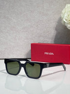 Prada black rectangular sunglasses with olive-tinted lenses and temple branding