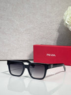 Prada black square sunglasses with dark lenses and logo on the temple