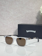 Sunglasses with light blue frames and brown lenses, gold-toned logo detail.