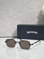 Chrome glasses with brown tinted lenses, gold details, and black temple arms