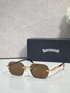 Chrome glasses with brown tinted lenses, gold frame details, and patterned temples