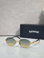 Round eyeglasses with gold-tone frame and light amber lenses, shown with case