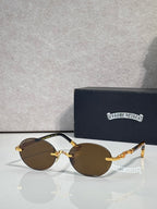 Round eyeglasses with gold-tone frame and dark lenses, with protective case