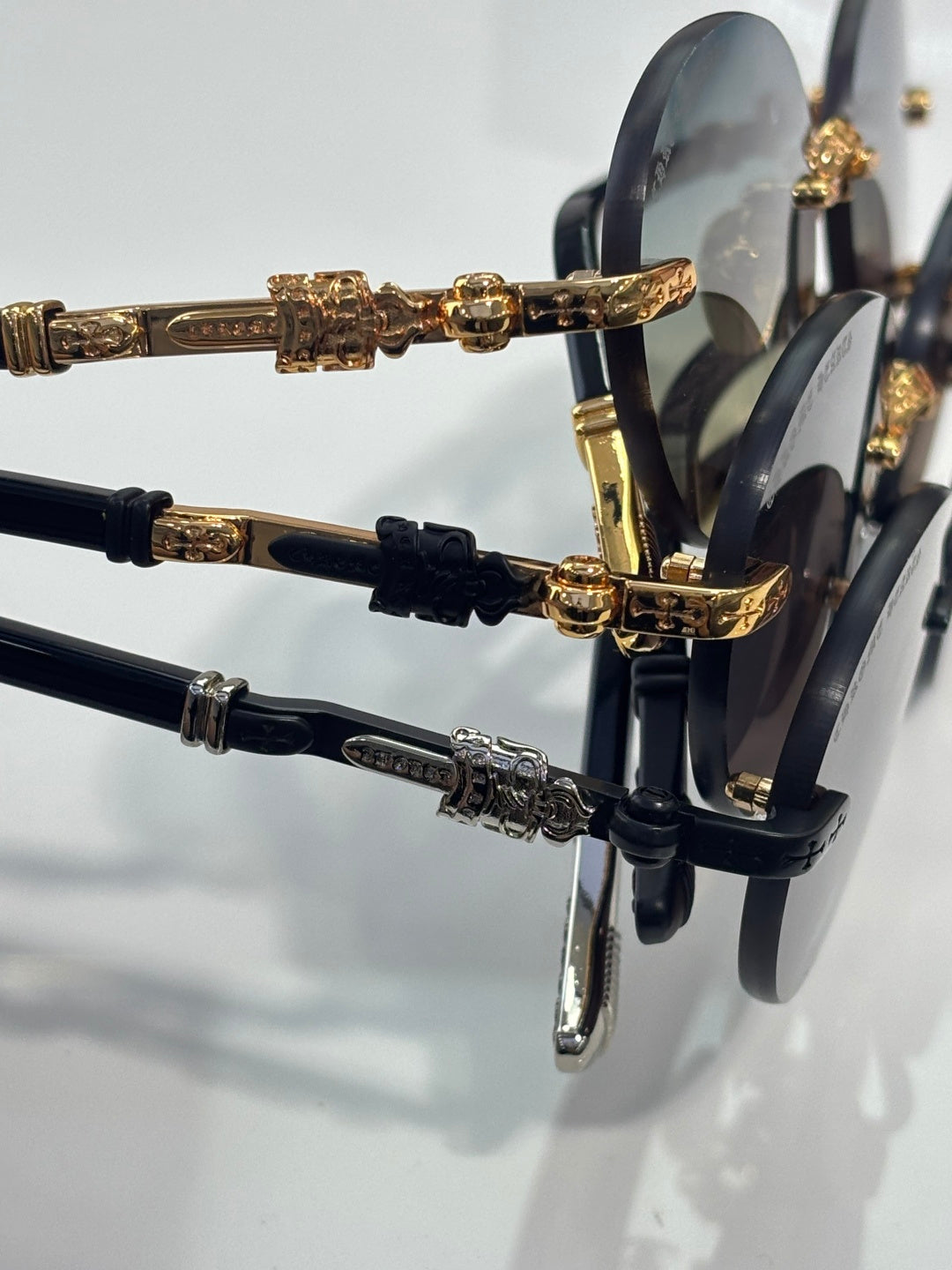 Side view close-up of eyeglass frames with gold detailing and dark temples