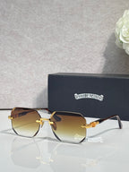 Chrome glasses with amber-tinted lenses, black frame, gold-tone arms with logo