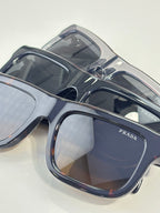 Prada glasses, blue acetate frames with tinted lenses