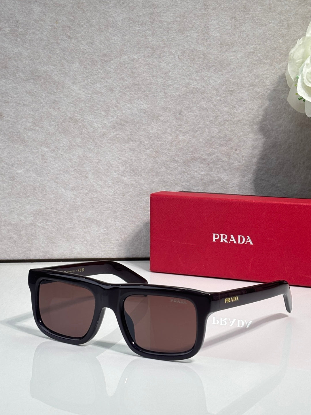 Prada glasses with black frame and brown lenses