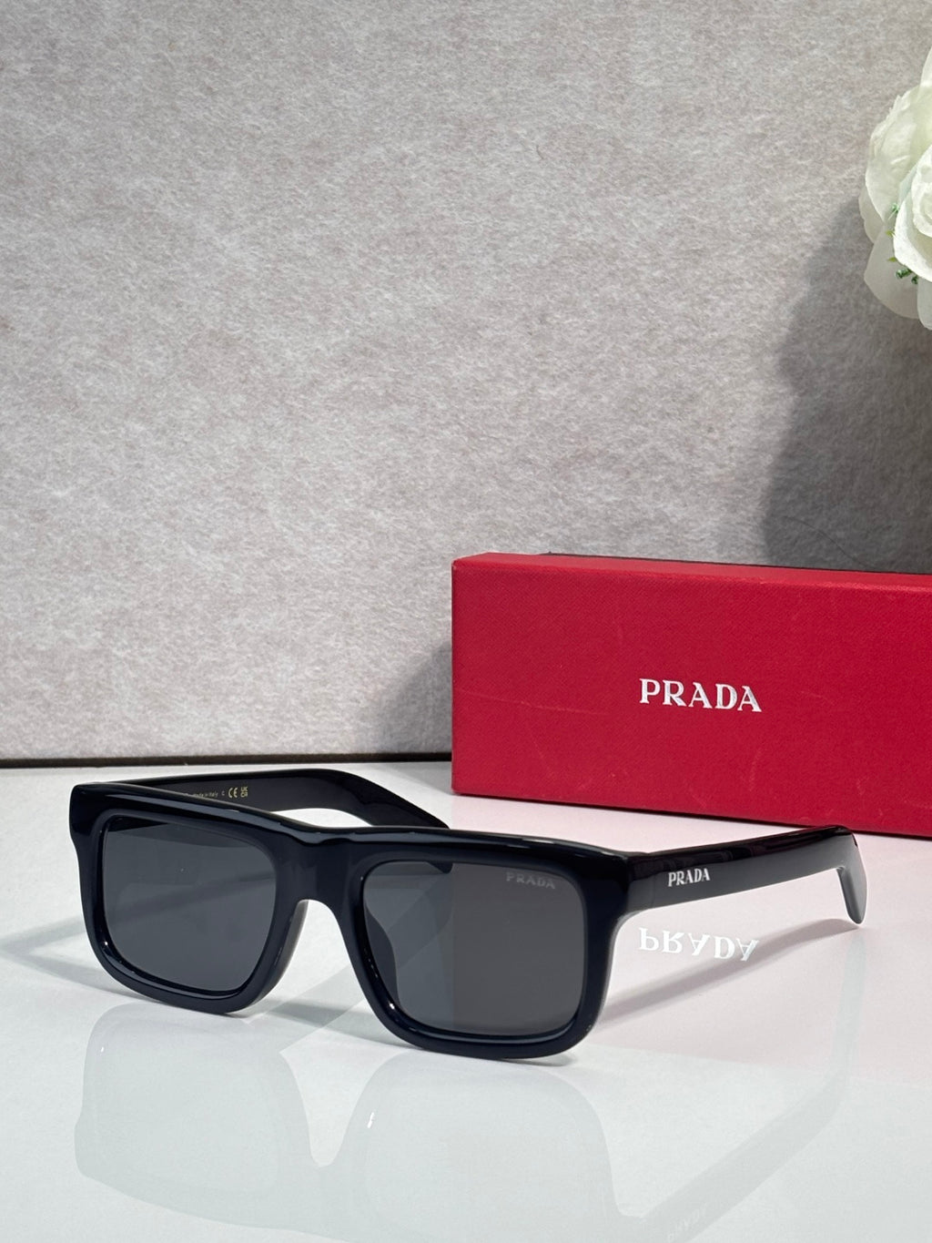 Prada glasses with dark blue frame and dark lenses