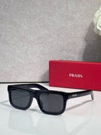 Prada glasses with dark blue frame and dark lenses