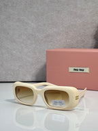 Cream full-frame sunglasses with thick acetate and rounded square lenses