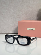 Black full-frame sunglasses with thick acetate arms and logo on lenses