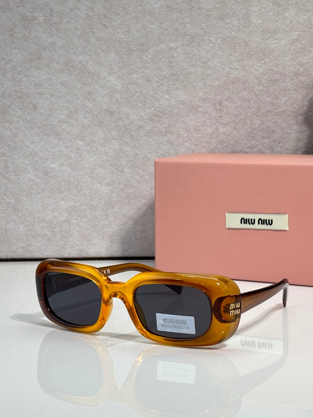 Amber yellow full-frame sunglasses with thick acetate and rounded square lenses