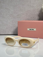 Round sunglasses with cream frames and oval lenses