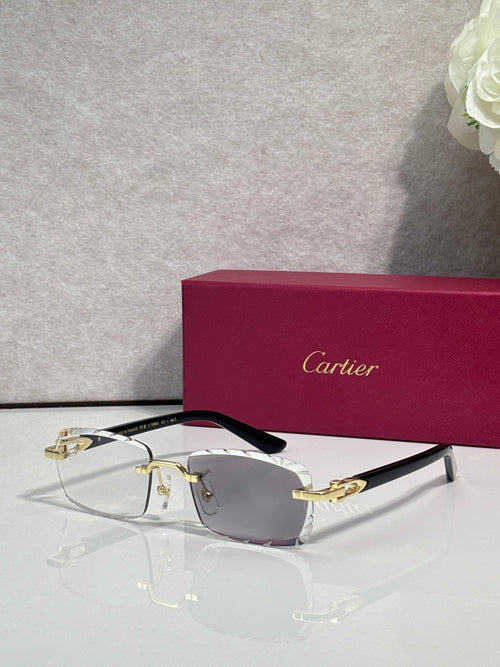 Cartier eyeglasses with gray lenses, silver metal frame, gold accents, and black temple tips.