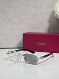 Cartier eyeglasses with clear lenses, silver metal frame, and black temple tips.