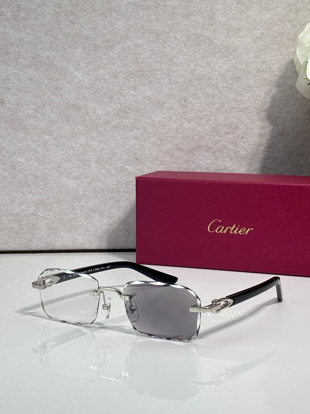 Cartier glasses with black frame, gold accents, clear lenses with gray tint