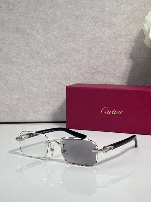 Cartier glasses with black frame, gold accents, clear lenses with gray tint