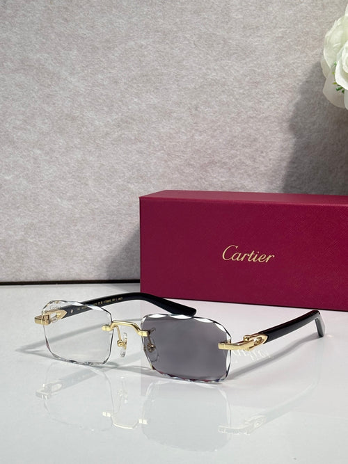 Cartier glasses with black frame, gold accents, clear lenses with smoky tint