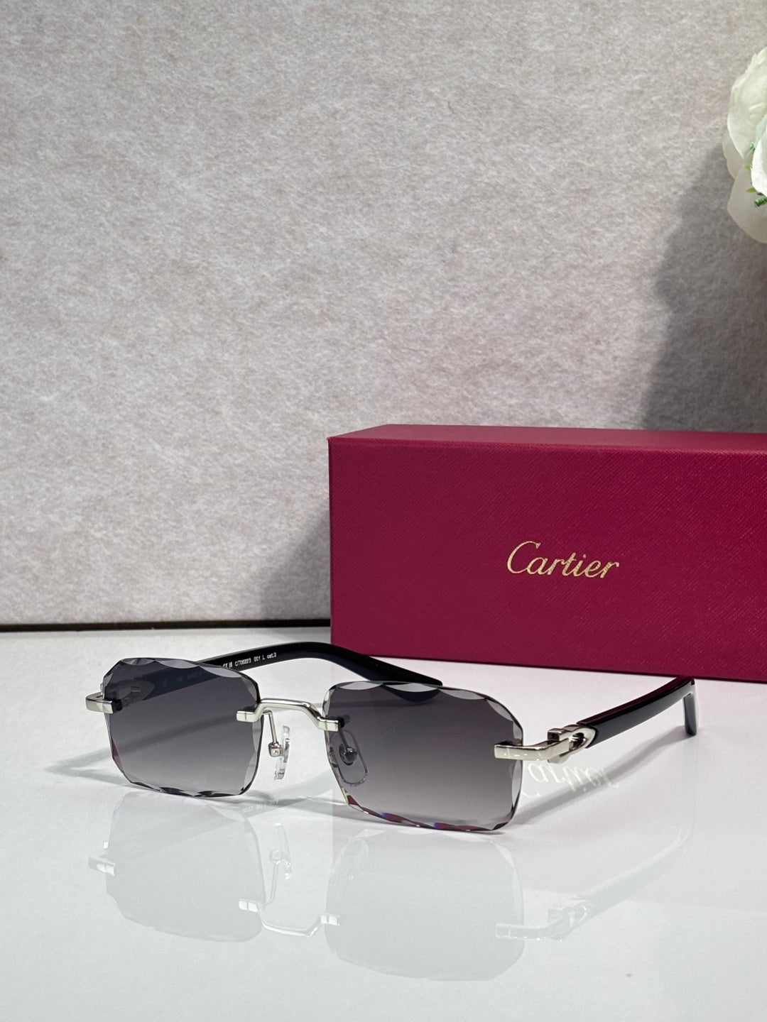 Cartier glasses with black frame, gold accents, clear lenses with dark tint