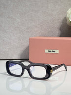 MiuMiu glasses with black frame and clear lenses, rectangular shape