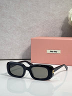 Glasses with black frame and dark tinted lenses, rounded rectangular face