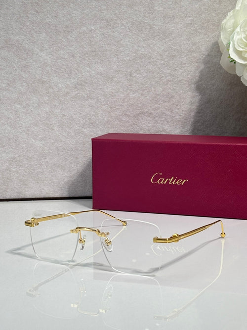 Gold metal eyeglasses with clear lenses, Cartier frame details.