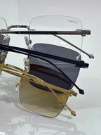 Side view of tinted sunglasses with gold and navy metal frames, Cartier.