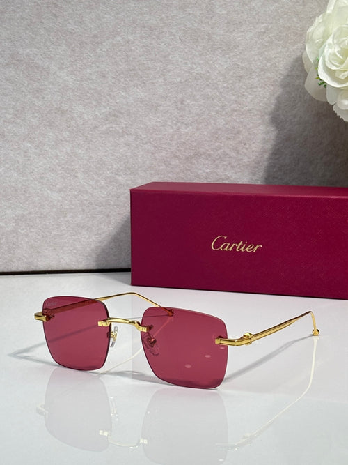 Cartier sunglasses with burgundy tinted lenses and gold frame, clear side arms.