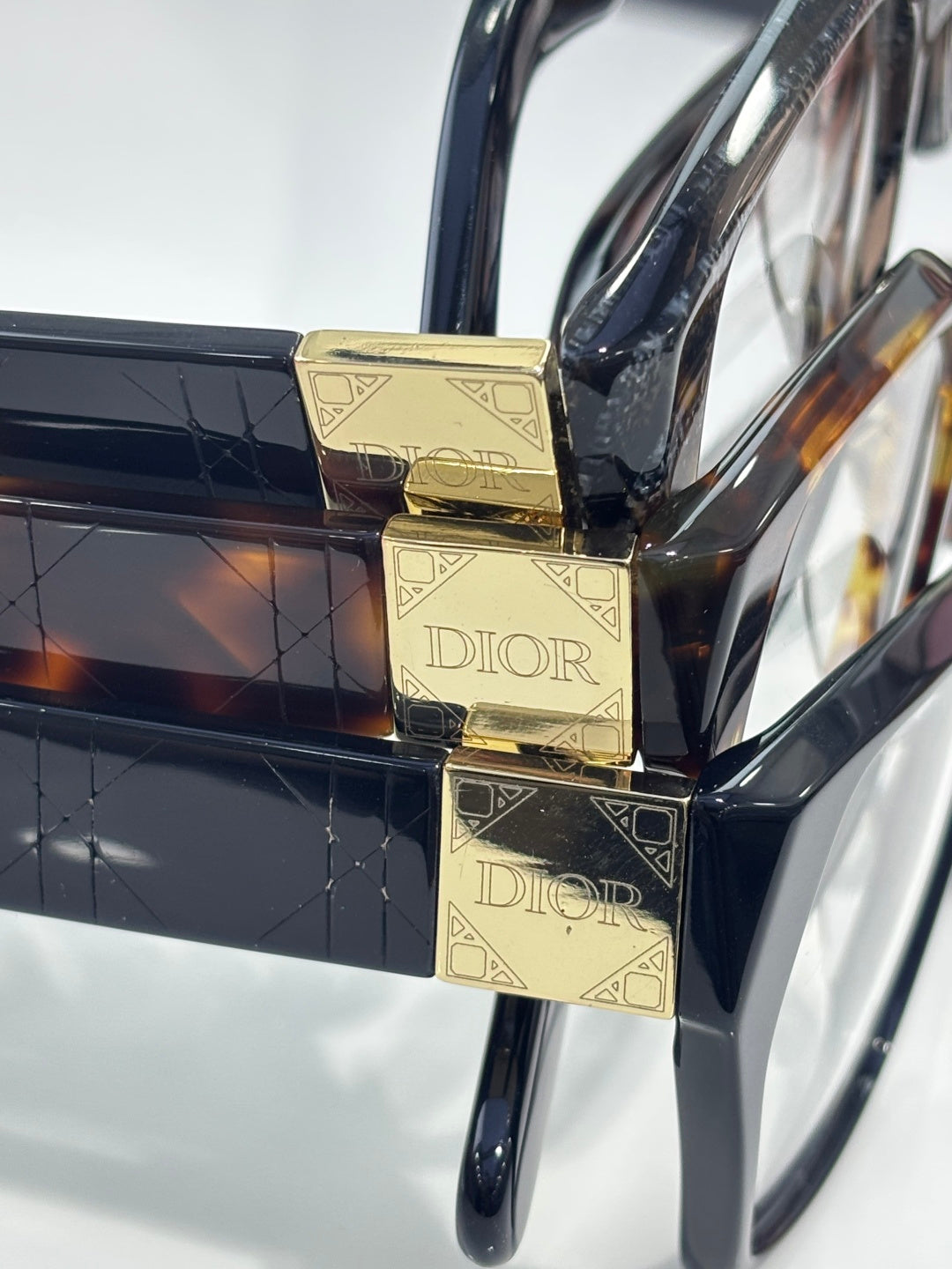 Dior eyeglasses, gold logo cube temple details on glossy frames