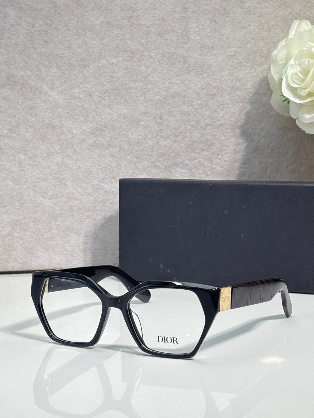 Dior eyeglasses, black acetate frame with gold details at temples, rectangular lenses