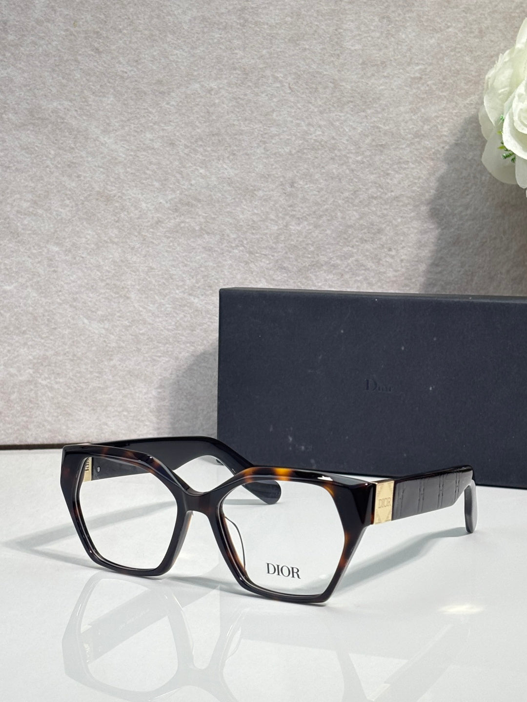 Dior eyeglasses, dark frame with tortoise temples, rectangular lenses