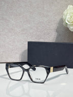 Dior eyeglasses, black acetate frame with gold-toned temples, rectangular lenses