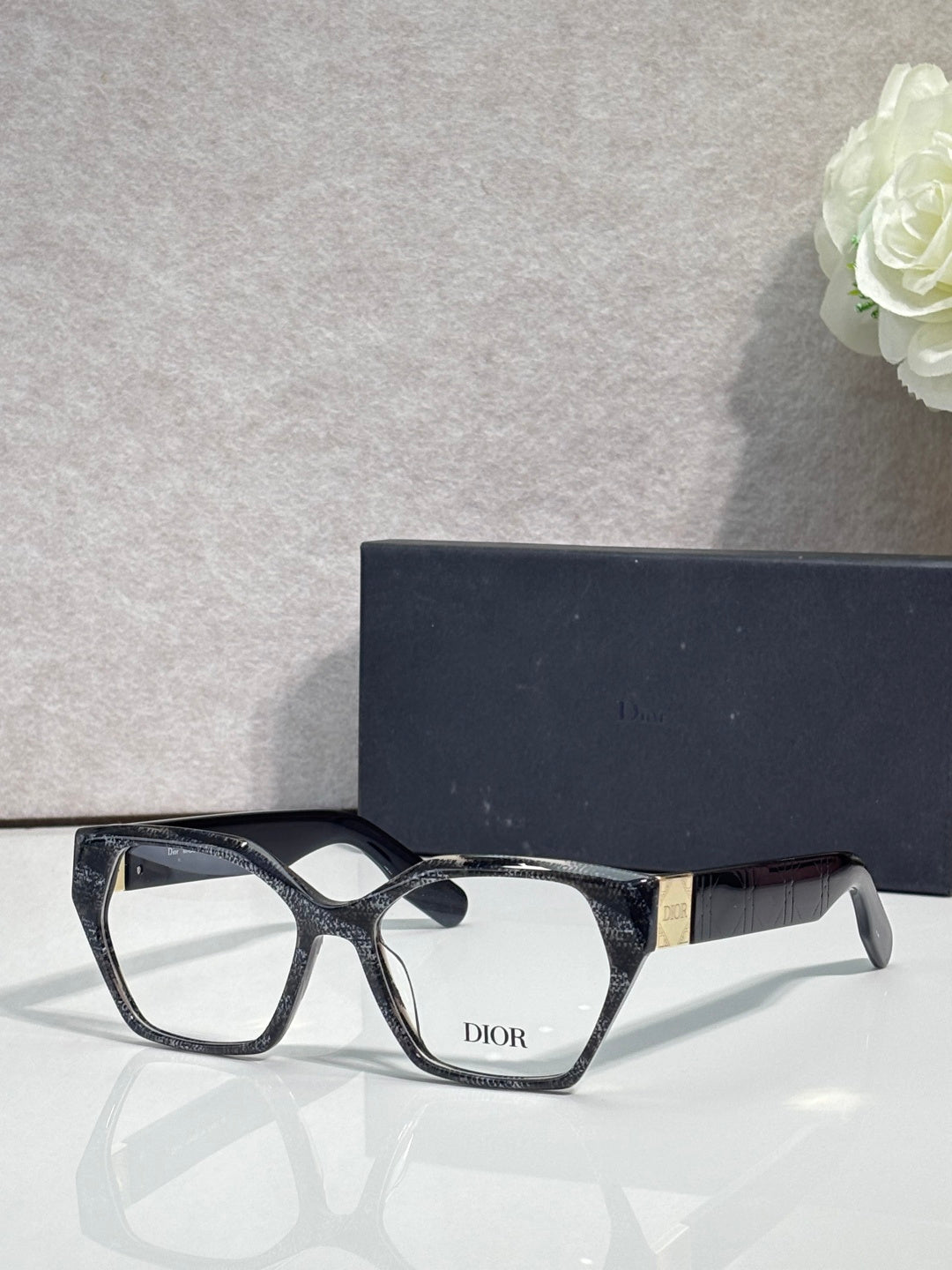 Dior eyeglasses, black acetate frame with gold-toned temples, rectangular lenses