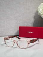 Transparent tortoiseshell Prada eyeglasses with rectangular frames and clear lenses