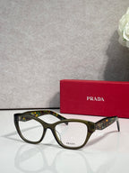 Green patterned Prada eyeglasses with rectangular frames and clear lenses