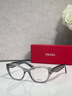 Silver gray Prada eyeglasses with rectangular frames and clear lenses