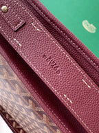 Maroon Goyard bag strap with contrast stitching and debossed logo on leather