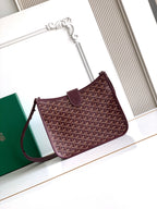 Maroon Goyard shoulder bag with patterned front panel and wrist strap