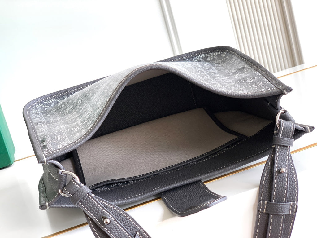 Goyard monogram hobo bag open top showing interior lining and shoulder strap, dark gray