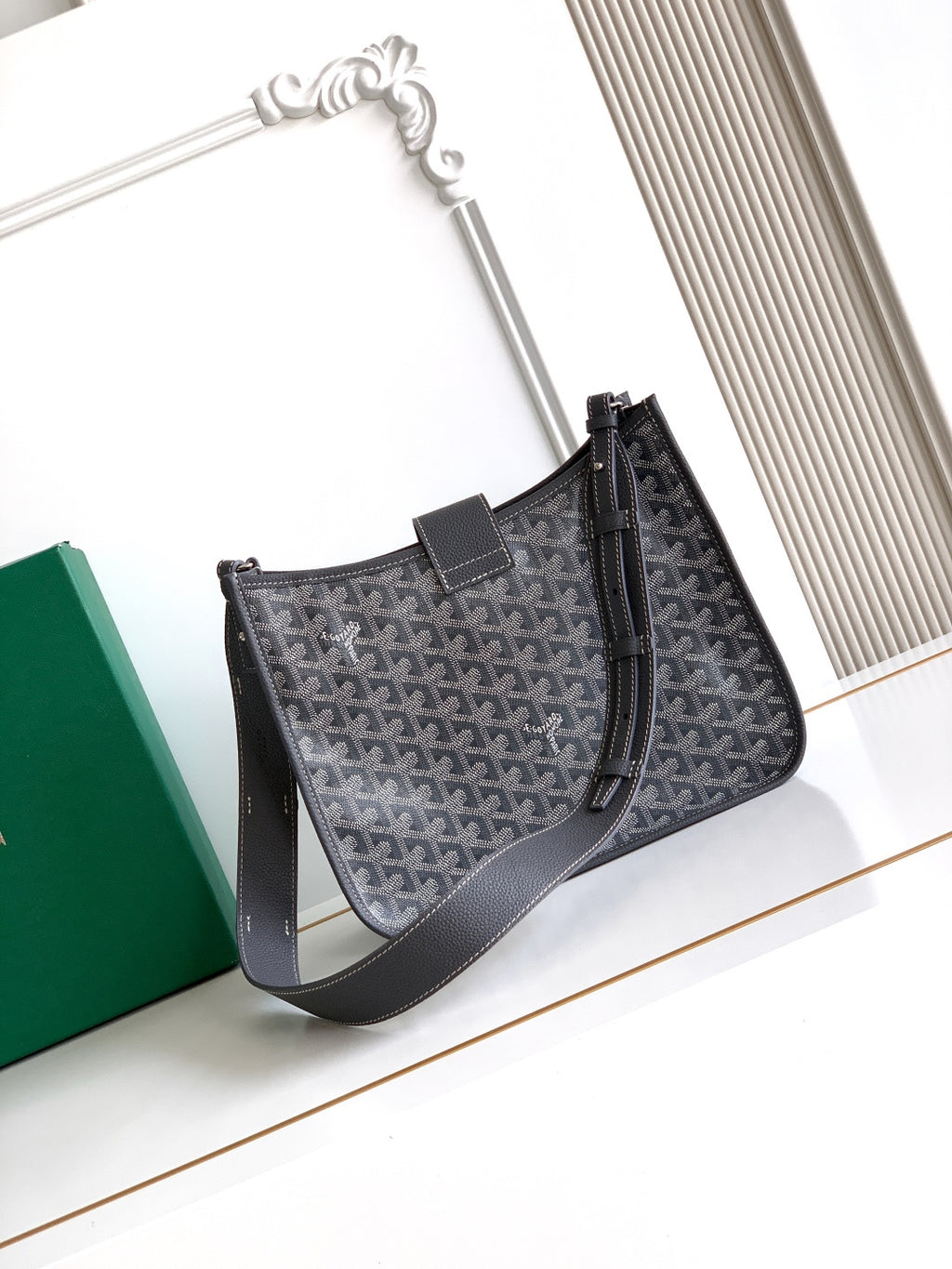 Goyard monogram hobo bag front view with top handle and shoulder strap, dark gray