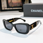 Dark gray sunglasses with black fabric temples and gold logo detail