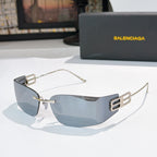Shield sunglasses with gold frames and blue-gray tinted lenses, front view