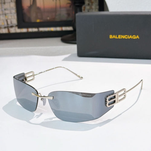 Shield sunglasses with gold frames and blue-gray tinted lenses, front view