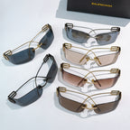 Assorted shield sunglasses set with gold frames and tinted lenses, stacked display