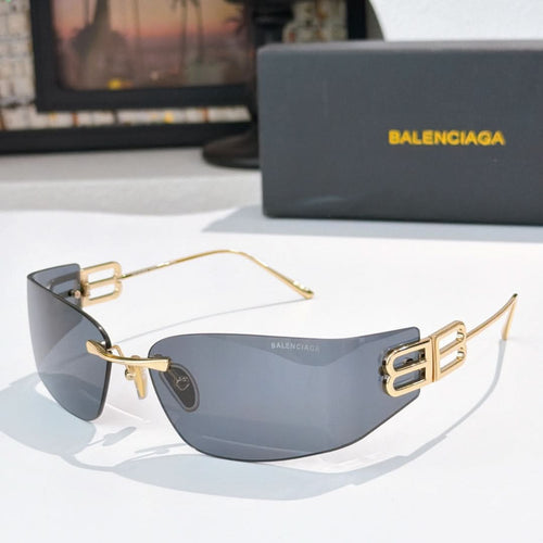 Shield sunglasses with gold frames and blue-gray tinted lenses, square logo temples